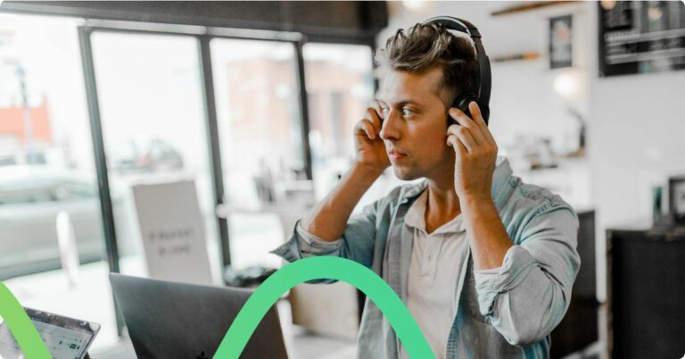 Person with headphones experiencing voice automation with a contact center.